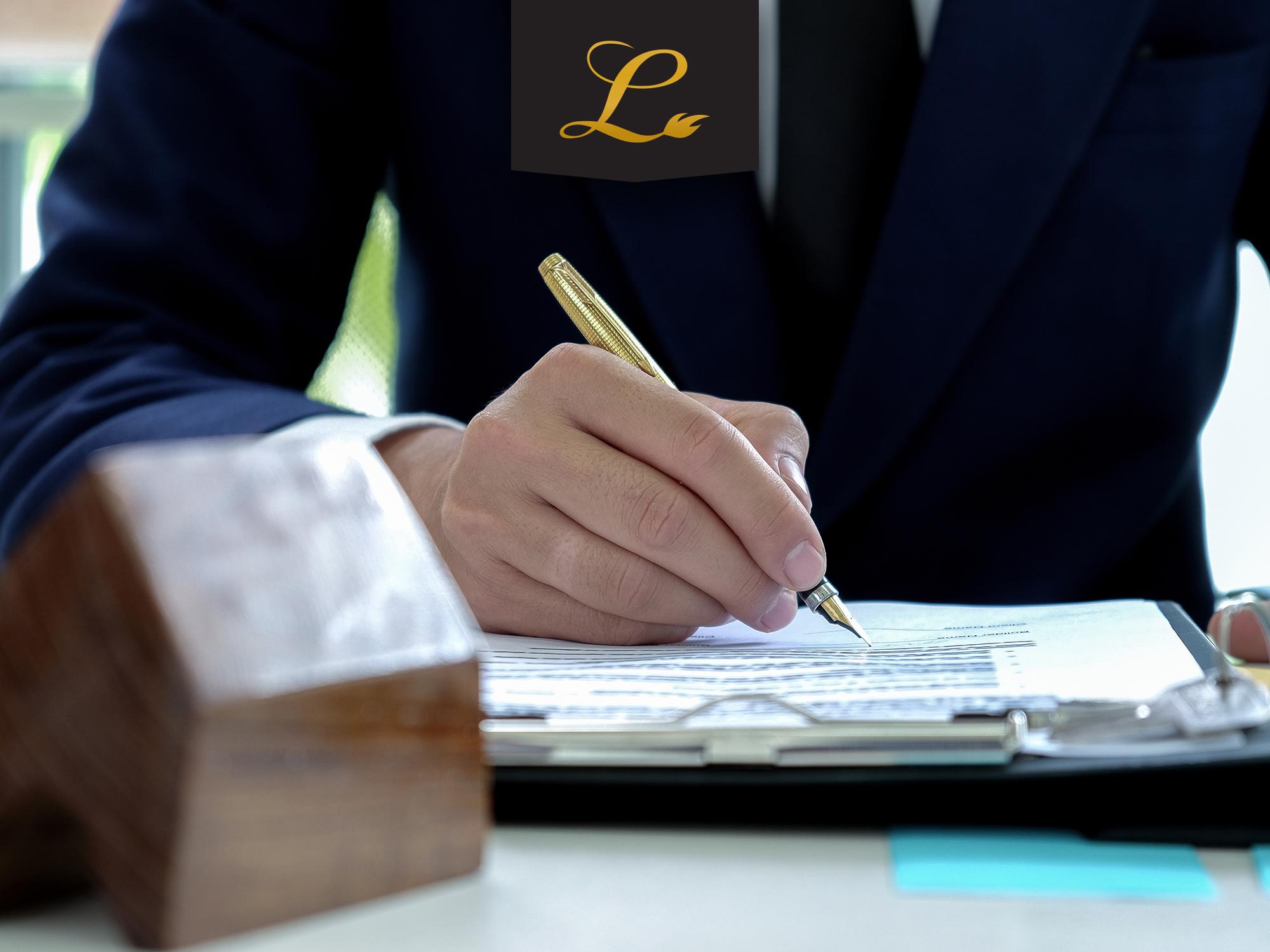 Person at their desk working on filling out the PPP loan application, however, be sure you are aware of the forgiveness requirements